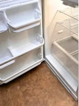 Refrigerator with clean door shelves after cleaning