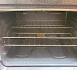 Clean oven interior with shining racks after cleaning