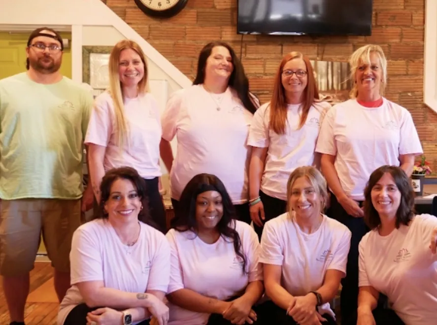 The Back To The Garden Cleaning team smiling together indoors